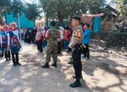 Semarak Peringatan HUT RI Ke-81 Polsek Madapangga Gelar Patroli Pengamanan Lomba Gerak Jalan Unik Tingkat Desa Dena